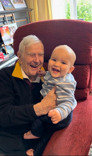 Duncan Hilling with Theodore Metcalf on a chair