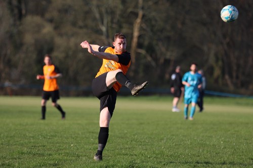 Johnston's Martin John clears the ball