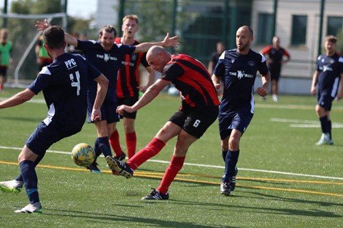 Dan Storer takes a shot on goal for Tenby