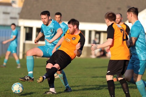 Johnston's Craig Bendall plays the ball