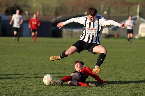 Carew's Dylan Morgan tracks back and makes a great tackle
