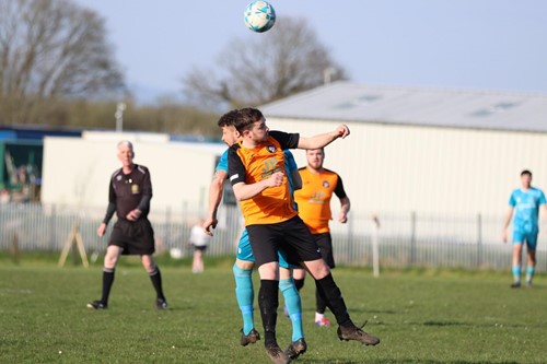 Johnston's Lewis Boswell heads the ball