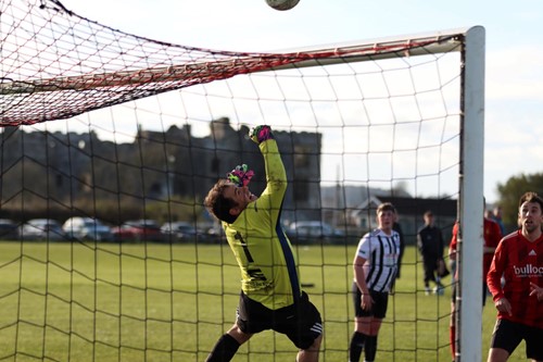 Neyland goalkeeper Patrick Hannon tips the ball over the bar