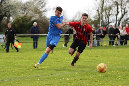 Rhys Jones holds of a challenge from Monkton